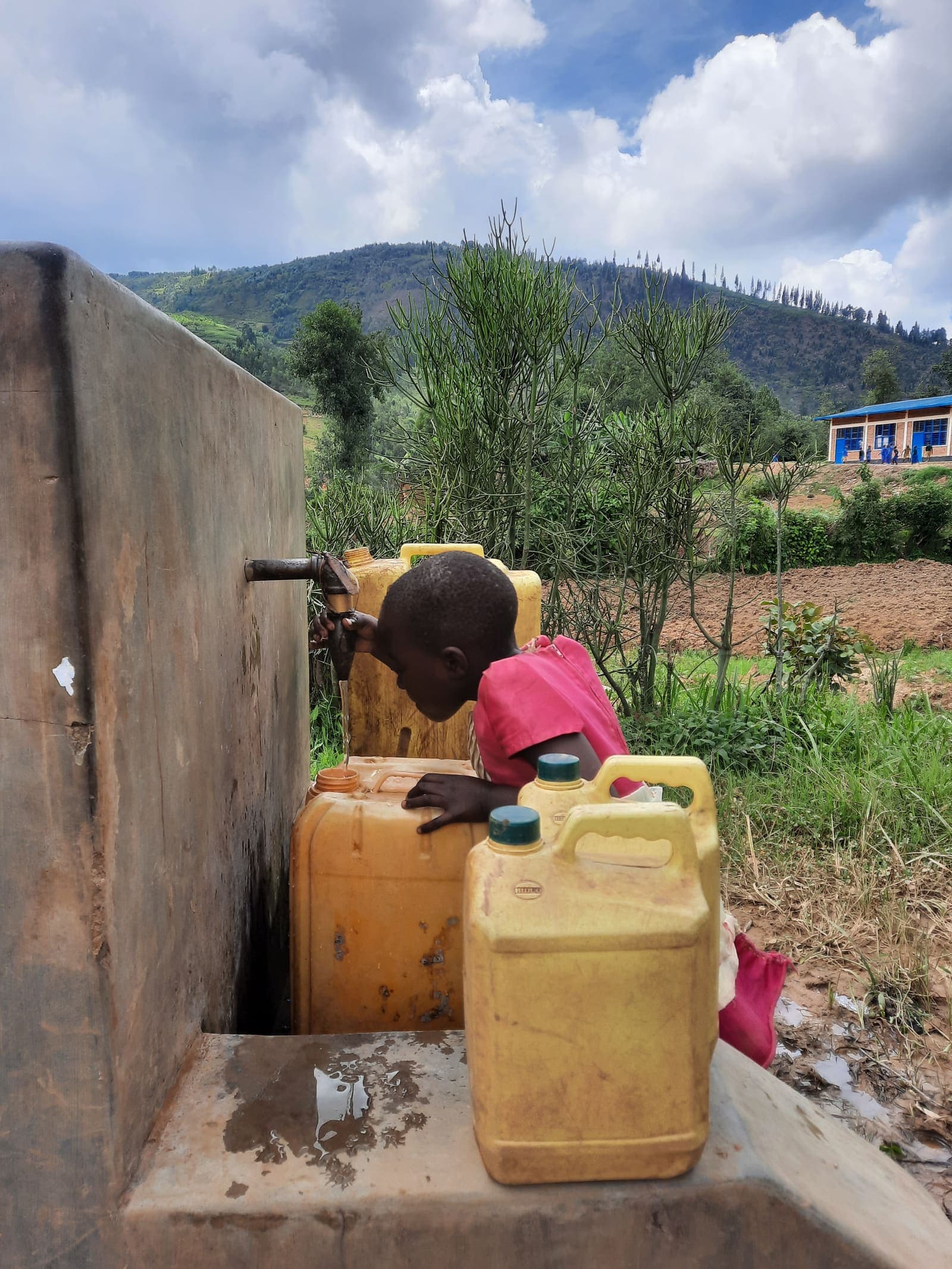 A person accessing clean water in their community