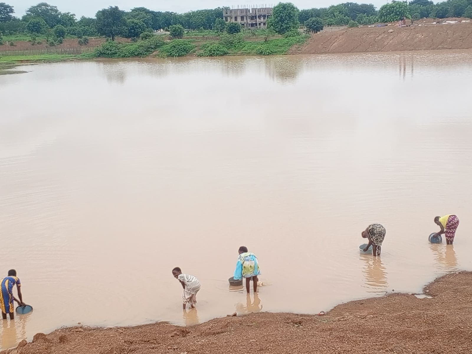 Children fetching water from a community dam