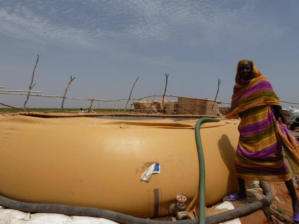 A community member accessing clean water